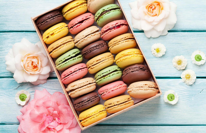 4: Macaron, France 37: Baklava, various locations, 36: Rolex, Uganda, 35: Dadar gulung, Indonesia, 34: Ta'ameya, Egypt, 33: Brownies, USA, 32: Plantain chips, various locations, 31: Koeksister, South Africa, 30: Ma'amoul, Egypt, 29: Takoyaki, Japan, 28: Rice Krispie treats, USA, 27: Poffertjes, Netherlands, 26: Haggis bon bons, Scotland, 25: Pão de queijo, Brazil, 24: Chocolate digestives, UK, 23: Churros, Spain, 22: Kartoffelpuffer, Germany, 21: Stroopwafel, Netherlands, 20: Mooncake, China, 19: Sausage roll, UK, 18: Biltong, South Africa, 17: Aloo tikki, India, 16: Qatayef, Middle East, 15: Lamington, Australia, 14: S'mores, USA, 13: Meat pie, Australia and New Zealand, 12: Lumpia, Indonesia and the Philippines, 11: Nanaimo bar, Canada, 10: Pain au chocolat, France, 9: Mochi, Japan, 8: Pani puri, India, 7: Doughnut, various locations, 6: Poutine, Canada, 5: Currywurst, Germany, 4: Macaron, France, 3: Nachos, Mexico, 2: Samosa, various locations