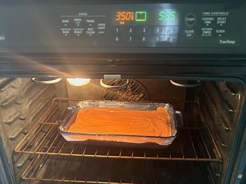 I placed my cake in the oven, which had been preheated to 350 degrees Fahrenheit. Garten's chocolate cake features cocoa powder, espresso powder, and "good" vanilla., You'll also need some ingredients for the mocha frosting., I also prepped my dry ingredients ..., … and my chocolate-and-coffee mixture., It was time to start the batter., Then I added the vanilla and eggs., My cake batter was ready!, While my cake was cooling, I began making the frosting., I also prepped the cream., Once the cream was ready, I poured it over the chocolate mixture., Then I stirred in the Kahlúa and vanilla., I covered my frosting and refrigerated it for 30 minutes., It was time to frost my cake., Garten's chocolate cake with mocha icing tasted rich and decadent.