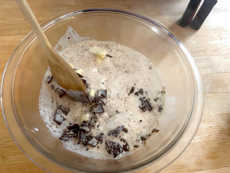 Once the cream was ready, I poured it over the chocolate mixture. Garten's chocolate cake features cocoa powder, espresso powder, and "good" vanilla., You'll also need some ingredients for the mocha frosting., I also prepped my dry ingredients ..., … and my chocolate-and-coffee mixture., It was time to start the batter., Then I added the vanilla and eggs., My cake batter was ready!, While my cake was cooling, I began making the frosting., I also prepped the cream., Once the cream was ready, I poured it over the chocolate mixture., Then I stirred in the Kahlúa and vanilla., I covered my frosting and refrigerated it for 30 minutes., It was time to frost my cake., Garten's chocolate cake with mocha icing tasted rich and decadent.
