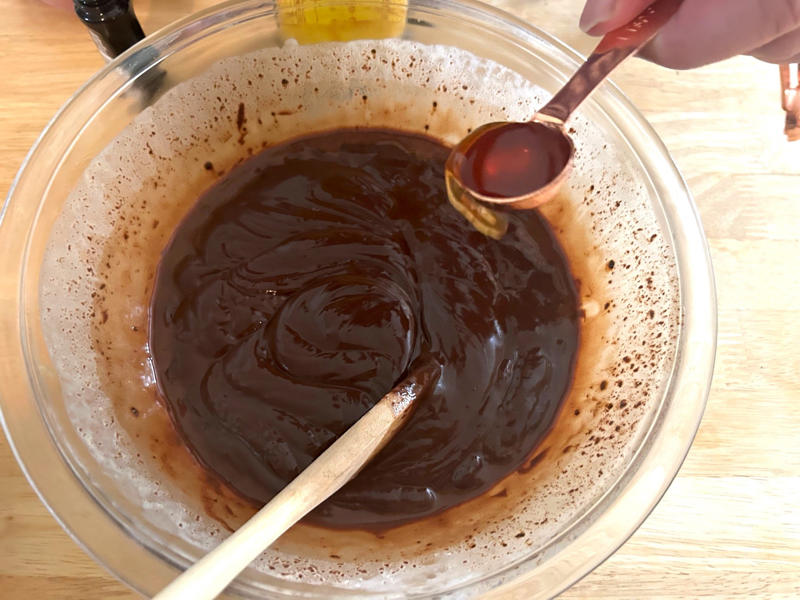 Then I stirred in the Kahlúa and vanilla. Garten's chocolate cake features cocoa powder, espresso powder, and "good" vanilla., You'll also need some ingredients for the mocha frosting., I also prepped my dry ingredients ..., … and my chocolate-and-coffee mixture., It was time to start the batter., Then I added the vanilla and eggs., My cake batter was ready!, While my cake was cooling, I began making the frosting., I also prepped the cream., Once the cream was ready, I poured it over the chocolate mixture., Then I stirred in the Kahlúa and vanilla., I covered my frosting and refrigerated it for 30 minutes., It was time to frost my cake., Garten's chocolate cake with mocha icing tasted rich and decadent.