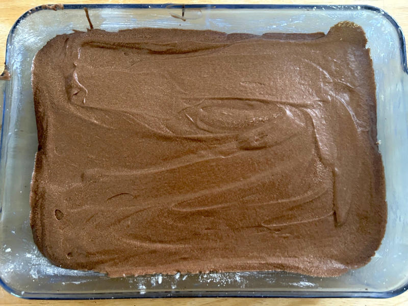 I poured my chocolate batter into the prepared pan and smoothed the top. Garten's chocolate cake features cocoa powder, espresso powder, and "good" vanilla., You'll also need some ingredients for the mocha frosting., I also prepped my dry ingredients ..., … and my chocolate-and-coffee mixture., It was time to start the batter., Then I added the vanilla and eggs., My cake batter was ready!, While my cake was cooling, I began making the frosting., I also prepped the cream., Once the cream was ready, I poured it over the chocolate mixture., Then I stirred in the Kahlúa and vanilla., I covered my frosting and refrigerated it for 30 minutes., It was time to frost my cake., Garten's chocolate cake with mocha icing tasted rich and decadent.