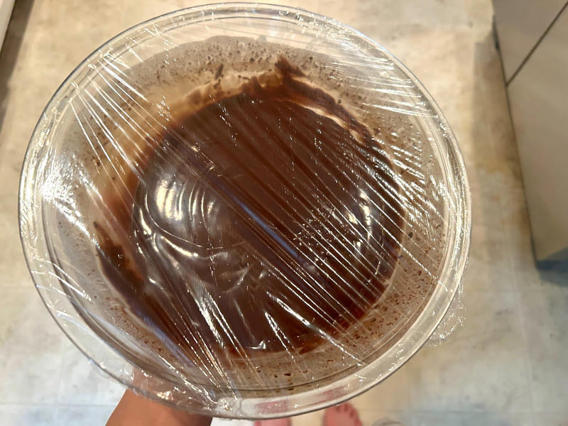 I covered my frosting and refrigerated it for 30 minutes. Garten's chocolate cake features cocoa powder, espresso powder, and "good" vanilla., You'll also need some ingredients for the mocha frosting., I also prepped my dry ingredients ..., … and my chocolate-and-coffee mixture., It was time to start the batter., Then I added the vanilla and eggs., My cake batter was ready!, While my cake was cooling, I began making the frosting., I also prepped the cream., Once the cream was ready, I poured it over the chocolate mixture., Then I stirred in the Kahlúa and vanilla., I covered my frosting and refrigerated it for 30 minutes., It was time to frost my cake., Garten's chocolate cake with mocha icing tasted rich and decadent.