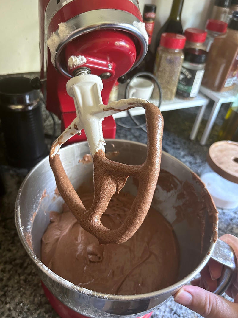 My cake batter was ready! Garten's chocolate cake features cocoa powder, espresso powder, and "good" vanilla., You'll also need some ingredients for the mocha frosting., I also prepped my dry ingredients ..., … and my chocolate-and-coffee mixture., It was time to start the batter., Then I added the vanilla and eggs., My cake batter was ready!, While my cake was cooling, I began making the frosting., I also prepped the cream., Once the cream was ready, I poured it over the chocolate mixture., Then I stirred in the Kahlúa and vanilla., I covered my frosting and refrigerated it for 30 minutes., It was time to frost my cake., Garten's chocolate cake with mocha icing tasted rich and decadent.