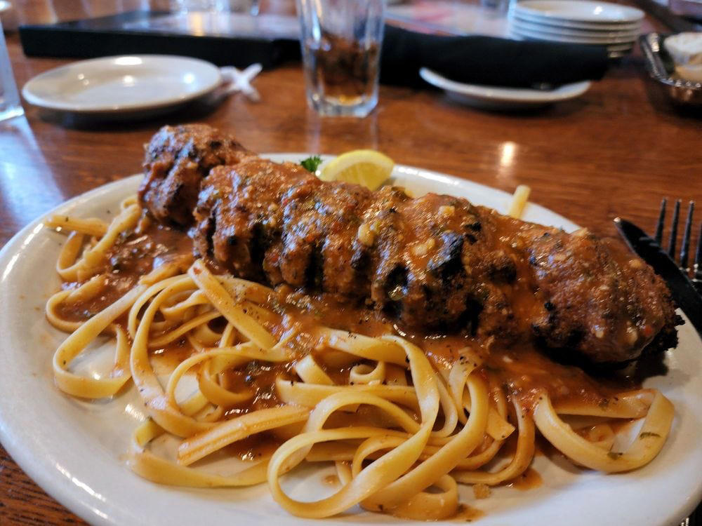ALABAMA: Gianmarco's Restaurant in Birmingham, ARIZONA: Marcellino Ristorante in Scottsdale, ARKANSAS: Bruno's Little Italy in Little Rock, CONNECTICUT: Mystic Pizza in Mystic, DELAWARE: Mrs. Robino's in Wilmington, FLORIDA: Christini's Ristorante Italiano in Orlando, GEORGIA: La Grotta Ristorante Italiano in Buckhead, Atlanta, HAWAII: Arancino in Honolulu, IDAHO: Luciano's Italian Restaurant in Boise, ILLINOIS: The Village in Chicago, INDIANA: Iaria's Italian Restaurant in Indianapolis, IOWA: Tumea &amp; Sons in Des Moines, KANSAS: Garozzo's in Kansas City, KENTUCKY: Pompilio's in Newport, LOUISIANA: Pascal's Manale in New Orleans, MAINE: Via Vecchia in Portland, MARYLAND: Il Pizzico in Rockville, MASSACHUSETTS: Regina Pizzeria in Boston, MICHIGAN: Buddy's Pizza in Detroit, MINNESOTA: Yarusso Bros in St. Paul, MISSISSIPPI: Giardina's Restaurant in Greenwood, MISSOURI: Jasper's Italian Restaurant in Kansas City, NEBRASKA: Orsi's Italian Bakery &amp; Pizzeria in Omaha, NEVADA: Piero's Italian Cuisine in Las Vegas, NEW HAMPSHIRE: The Rosa in Portsmouth, NEW MEXICO: Trombino's Bistro Italiano in Albuquerque, NEW YORK: Lombardi's in New York City, NORTH CAROLINA: Amedeo's Italian Restaurant in Raleigh, NORTH DAKOTA: Spaghetti Western in Fargo, OHIO: Guarino's in Cleveland, OKLAHOMA: Pete's Place in Krebs, OREGON: Nostrana in Portland, PENNSYLVANIA: The Victor Café in Philadelphia, RHODE ISLAND: Camille's in Providence, SOUTH CAROLINA: Villa Tronco in Columbia, SOUTH DAKOTA: Maribella Ristorante in Sioux Falls, TEXAS: Rosie Cannonball in Houston, UTAH: Valter's Osteria in Salt Lake City, VERMONT: Sarducci's in Montpelier, VIRGINIA: Luigi's Italian Gourmet in Roanoke, WASHINGTON: The Pink Door in Seattle, WEST VIRGINIA: Fazio's Italian Restaurant in Charleston, WISCONSIN: Calderone Club in Milwaukee, WYOMING: Calico Restaurant and Bar in Jackson