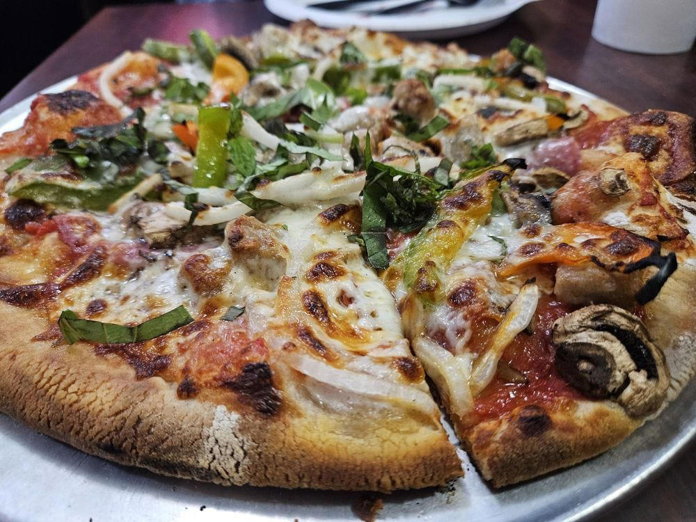 ALABAMA: Gianmarco's Restaurant in Birmingham, ARIZONA: Marcellino Ristorante in Scottsdale, ARKANSAS: Bruno's Little Italy in Little Rock, CONNECTICUT: Mystic Pizza in Mystic, DELAWARE: Mrs. Robino's in Wilmington, FLORIDA: Christini's Ristorante Italiano in Orlando, GEORGIA: La Grotta Ristorante Italiano in Buckhead, Atlanta, HAWAII: Arancino in Honolulu, IDAHO: Luciano's Italian Restaurant in Boise, ILLINOIS: The Village in Chicago, INDIANA: Iaria's Italian Restaurant in Indianapolis, IOWA: Tumea &amp; Sons in Des Moines, KANSAS: Garozzo's in Kansas City, KENTUCKY: Pompilio's in Newport, LOUISIANA: Pascal's Manale in New Orleans, MAINE: Via Vecchia in Portland, MARYLAND: Il Pizzico in Rockville, MASSACHUSETTS: Regina Pizzeria in Boston, MICHIGAN: Buddy's Pizza in Detroit, MINNESOTA: Yarusso Bros in St. Paul, MISSISSIPPI: Giardina's Restaurant in Greenwood, MISSOURI: Jasper's Italian Restaurant in Kansas City, NEBRASKA: Orsi's Italian Bakery &amp; Pizzeria in Omaha, NEVADA: Piero's Italian Cuisine in Las Vegas, NEW HAMPSHIRE: The Rosa in Portsmouth, NEW MEXICO: Trombino's Bistro Italiano in Albuquerque, NEW YORK: Lombardi's in New York City, NORTH CAROLINA: Amedeo's Italian Restaurant in Raleigh, NORTH DAKOTA: Spaghetti Western in Fargo, OHIO: Guarino's in Cleveland, OKLAHOMA: Pete's Place in Krebs, OREGON: Nostrana in Portland, PENNSYLVANIA: The Victor Café in Philadelphia, RHODE ISLAND: Camille's in Providence, SOUTH CAROLINA: Villa Tronco in Columbia, SOUTH DAKOTA: Maribella Ristorante in Sioux Falls, TEXAS: Rosie Cannonball in Houston, UTAH: Valter's Osteria in Salt Lake City, VERMONT: Sarducci's in Montpelier, VIRGINIA: Luigi's Italian Gourmet in Roanoke, WASHINGTON: The Pink Door in Seattle, WEST VIRGINIA: Fazio's Italian Restaurant in Charleston, WISCONSIN: Calderone Club in Milwaukee, WYOMING: Calico Restaurant and Bar in Jackson
