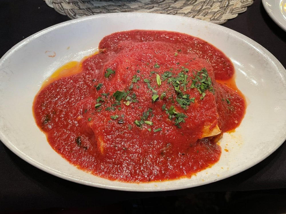 ALABAMA: Gianmarco's Restaurant in Birmingham, ARIZONA: Marcellino Ristorante in Scottsdale, ARKANSAS: Bruno's Little Italy in Little Rock, CONNECTICUT: Mystic Pizza in Mystic, DELAWARE: Mrs. Robino's in Wilmington, FLORIDA: Christini's Ristorante Italiano in Orlando, GEORGIA: La Grotta Ristorante Italiano in Buckhead, Atlanta, HAWAII: Arancino in Honolulu, IDAHO: Luciano's Italian Restaurant in Boise, ILLINOIS: The Village in Chicago, INDIANA: Iaria's Italian Restaurant in Indianapolis, IOWA: Tumea &amp; Sons in Des Moines, KANSAS: Garozzo's in Kansas City, KENTUCKY: Pompilio's in Newport, LOUISIANA: Pascal's Manale in New Orleans, MAINE: Via Vecchia in Portland, MARYLAND: Il Pizzico in Rockville, MASSACHUSETTS: Regina Pizzeria in Boston, MICHIGAN: Buddy's Pizza in Detroit, MINNESOTA: Yarusso Bros in St. Paul, MISSISSIPPI: Giardina's Restaurant in Greenwood, MISSOURI: Jasper's Italian Restaurant in Kansas City, NEBRASKA: Orsi's Italian Bakery &amp; Pizzeria in Omaha, NEVADA: Piero's Italian Cuisine in Las Vegas, NEW HAMPSHIRE: The Rosa in Portsmouth, NEW MEXICO: Trombino's Bistro Italiano in Albuquerque, NEW YORK: Lombardi's in New York City, NORTH CAROLINA: Amedeo's Italian Restaurant in Raleigh, NORTH DAKOTA: Spaghetti Western in Fargo, OHIO: Guarino's in Cleveland, OKLAHOMA: Pete's Place in Krebs, OREGON: Nostrana in Portland, PENNSYLVANIA: The Victor Café in Philadelphia, RHODE ISLAND: Camille's in Providence, SOUTH CAROLINA: Villa Tronco in Columbia, SOUTH DAKOTA: Maribella Ristorante in Sioux Falls, TEXAS: Rosie Cannonball in Houston, UTAH: Valter's Osteria in Salt Lake City, VERMONT: Sarducci's in Montpelier, VIRGINIA: Luigi's Italian Gourmet in Roanoke, WASHINGTON: The Pink Door in Seattle, WEST VIRGINIA: Fazio's Italian Restaurant in Charleston, WISCONSIN: Calderone Club in Milwaukee, WYOMING: Calico Restaurant and Bar in Jackson