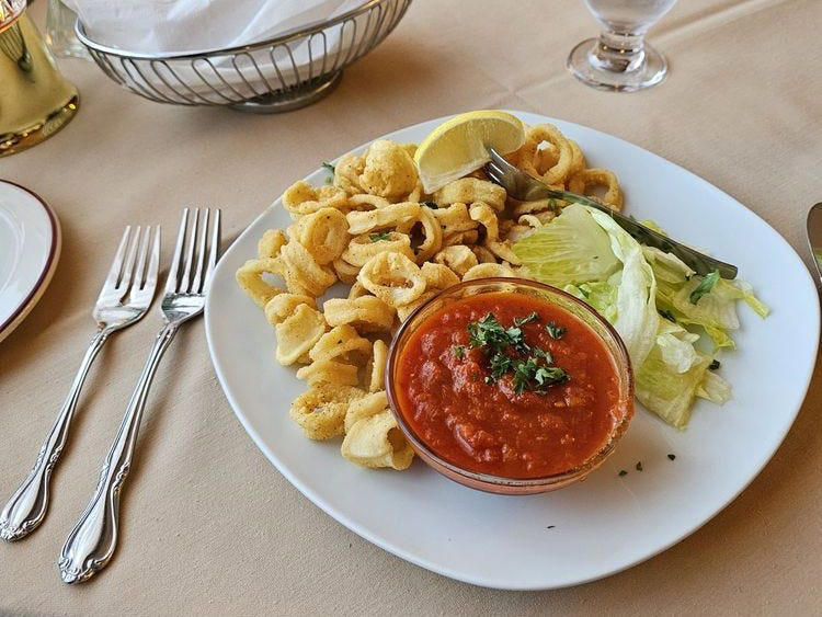 ALABAMA: Gianmarco's Restaurant in Birmingham, ARIZONA: Marcellino Ristorante in Scottsdale, ARKANSAS: Bruno's Little Italy in Little Rock, CONNECTICUT: Mystic Pizza in Mystic, DELAWARE: Mrs. Robino's in Wilmington, FLORIDA: Christini's Ristorante Italiano in Orlando, GEORGIA: La Grotta Ristorante Italiano in Buckhead, Atlanta, HAWAII: Arancino in Honolulu, IDAHO: Luciano's Italian Restaurant in Boise, ILLINOIS: The Village in Chicago, INDIANA: Iaria's Italian Restaurant in Indianapolis, IOWA: Tumea &amp; Sons in Des Moines, KANSAS: Garozzo's in Kansas City, KENTUCKY: Pompilio's in Newport, LOUISIANA: Pascal's Manale in New Orleans, MAINE: Via Vecchia in Portland, MARYLAND: Il Pizzico in Rockville, MASSACHUSETTS: Regina Pizzeria in Boston, MICHIGAN: Buddy's Pizza in Detroit, MINNESOTA: Yarusso Bros in St. Paul, MISSISSIPPI: Giardina's Restaurant in Greenwood, MISSOURI: Jasper's Italian Restaurant in Kansas City, NEBRASKA: Orsi's Italian Bakery &amp; Pizzeria in Omaha, NEVADA: Piero's Italian Cuisine in Las Vegas, NEW HAMPSHIRE: The Rosa in Portsmouth, NEW MEXICO: Trombino's Bistro Italiano in Albuquerque, NEW YORK: Lombardi's in New York City, NORTH CAROLINA: Amedeo's Italian Restaurant in Raleigh, NORTH DAKOTA: Spaghetti Western in Fargo, OHIO: Guarino's in Cleveland, OKLAHOMA: Pete's Place in Krebs, OREGON: Nostrana in Portland, PENNSYLVANIA: The Victor Café in Philadelphia, RHODE ISLAND: Camille's in Providence, SOUTH CAROLINA: Villa Tronco in Columbia, SOUTH DAKOTA: Maribella Ristorante in Sioux Falls, TEXAS: Rosie Cannonball in Houston, UTAH: Valter's Osteria in Salt Lake City, VERMONT: Sarducci's in Montpelier, VIRGINIA: Luigi's Italian Gourmet in Roanoke, WASHINGTON: The Pink Door in Seattle, WEST VIRGINIA: Fazio's Italian Restaurant in Charleston, WISCONSIN: Calderone Club in Milwaukee, WYOMING: Calico Restaurant and Bar in Jackson
