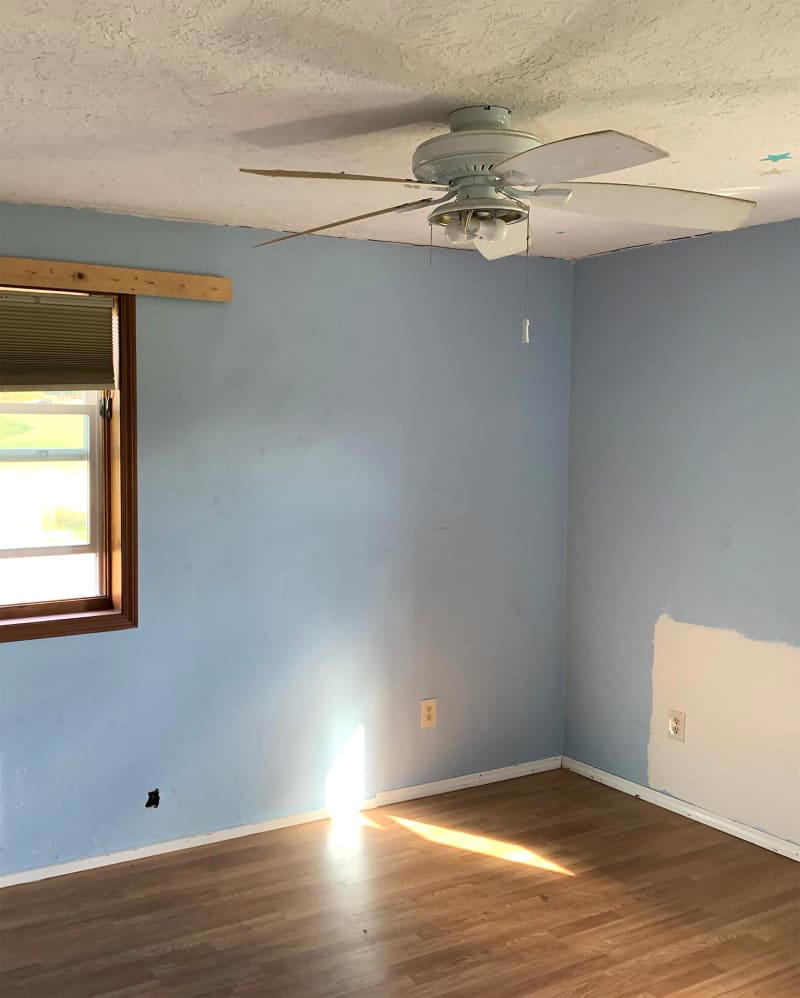 A budget-friendly flooring upgrade ditches the run-down feel., The walls, ceiling, and trim got fresh paint., Rope-style trim adds budget-friendly character., Secondhand finds (plus some fun new items) add the finishing touches.