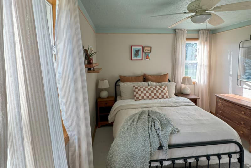 A budget-friendly flooring upgrade ditches the run-down feel., The walls, ceiling, and trim got fresh paint., Rope-style trim adds budget-friendly character., Secondhand finds (plus some fun new items) add the finishing touches.