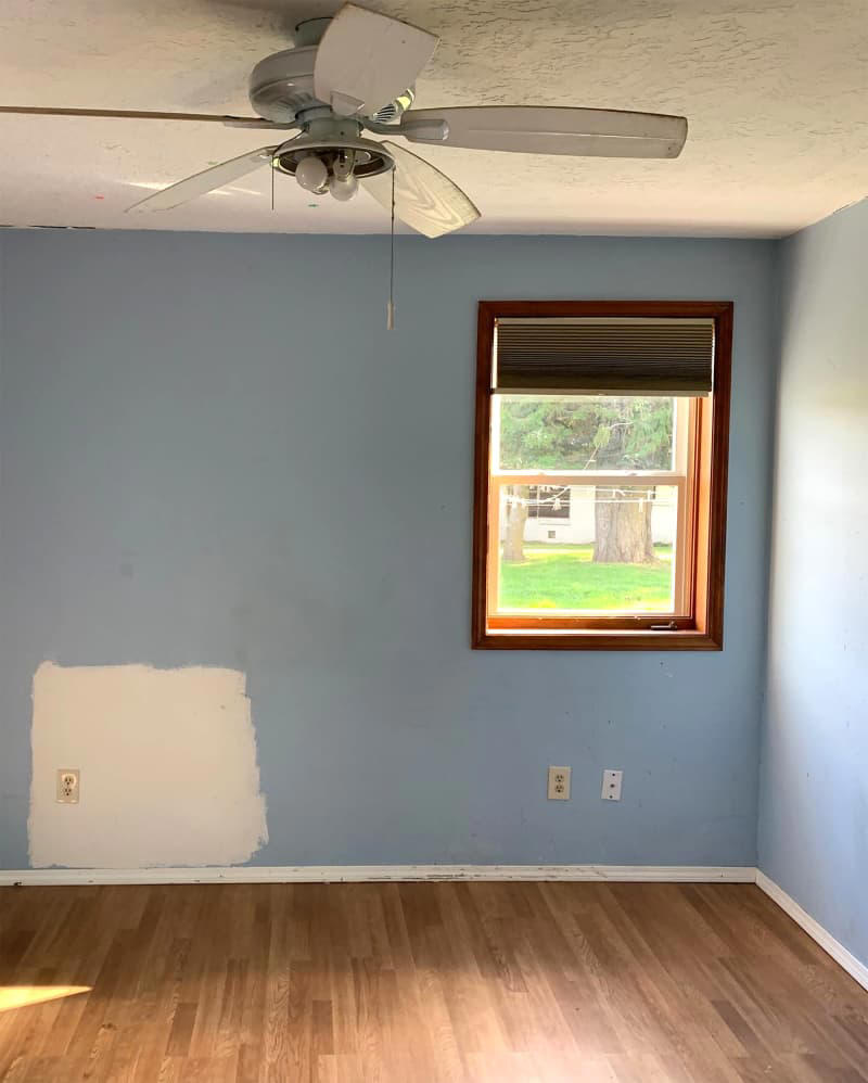 A budget-friendly flooring upgrade ditches the run-down feel., The walls, ceiling, and trim got fresh paint., Rope-style trim adds budget-friendly character., Secondhand finds (plus some fun new items) add the finishing touches.
