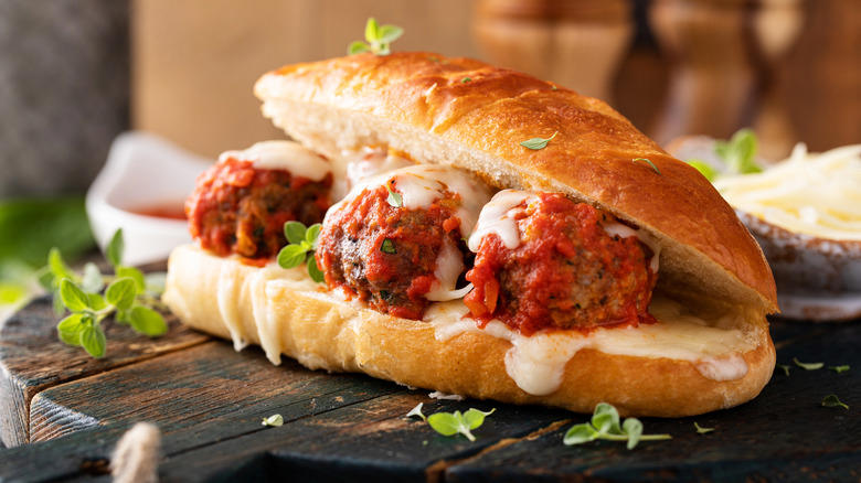 1. Cook them in grape jelly for a sweet and savory snack, 2. Stuff frozen meatballs into a sandwich, 3. Use frozen meatballs as taco filling, 4. Combine them with pineapple and peppers for a sweet and sour dish, 5. Serve frozen meatballs with gravy on top of mashed potatoes, 6. Pile them onto a pizza, 7. Add frozen meatballs to veggie soup to bulk up the dish, 8. Air fry meatballs for a crispy bite, 9. Make bite-sized sliders for your next party, 10. Bake frozen meatballs into a casserole for a hearty dinner, 11. Stuff the meatballs in pasta shells, 12. Cook them in a curry sauce to maximize flavor, 13. Add them to French onion soup