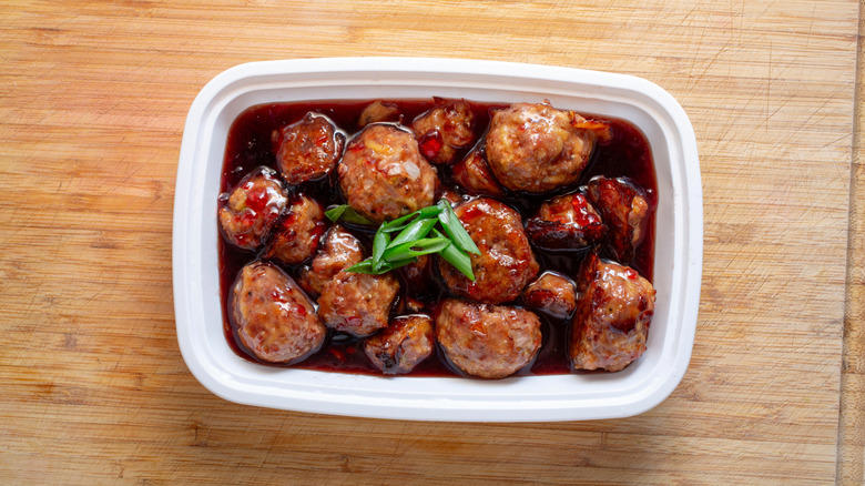 1. Cook them in grape jelly for a sweet and savory snack, 2. Stuff frozen meatballs into a sandwich, 3. Use frozen meatballs as taco filling, 4. Combine them with pineapple and peppers for a sweet and sour dish, 5. Serve frozen meatballs with gravy on top of mashed potatoes, 6. Pile them onto a pizza, 7. Add frozen meatballs to veggie soup to bulk up the dish, 8. Air fry meatballs for a crispy bite, 9. Make bite-sized sliders for your next party, 10. Bake frozen meatballs into a casserole for a hearty dinner, 11. Stuff the meatballs in pasta shells, 12. Cook them in a curry sauce to maximize flavor, 13. Add them to French onion soup