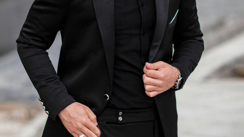 1. A High-End Watch, 2. Form-Fitting Henleys, 3. Signature Cologne, 4. Statement Sneakers, 5. Crisp White Dress Shirts, 6. Tailored Blazers, 7. Leather Jackets, 8. Well-Groomed Facial Hair, 9. Graphic Tees with a Story, 10. Dark Slim-Fit Jeans, 11. Stylish Sunglasses, 12. Chelsea Boots, 13. Rolled-Up Sleeves, 14. A Bold Tie, 15. Minimalist Jewelry, 16. V-Neck Sweaters, 17. Baseball Caps (The Right Way), 18. Patterned Socks, 19. A Premium Belt, 20. The "Power" Suit