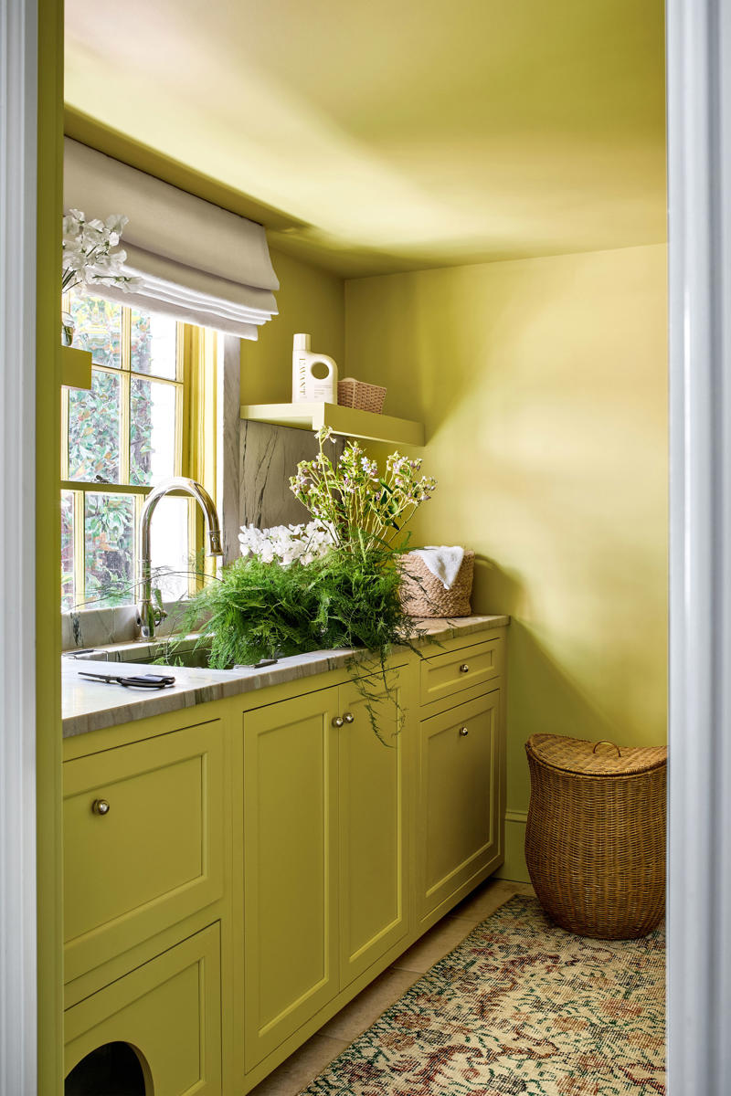 Embrace a color-drenching moment, Say yes to spray paint, Just add curtains, Nod to location, Work your vertical space, Don’t overlook the floor, Use a sliding door, Don’t hold back on detail, Add a clothing rod, Create a multiuse space, Add color with a bold wallpaper, Plan around storage, Don’t forget the art, Install high shelving, Put every flat surface to use, Incorporate hampers for easy organization, Put a drying rack on the wall, It’s okay to cover windows, Keep laundry materials out of sight, Create a dual mudroom, Built-in furniture is not the only path to success, Place pattern all over, Install a unique light fixture, Place cabinets on top of your washer/dryer, Add texture with cabinet fronts, Hide away your washer and dryer, Camouflage appliances, Go for sliding racks, Lean into neutrals, Add a countertop to a galley laundry room, Choose a vibrant color scheme, Play with geometry, Opt for moody elegance