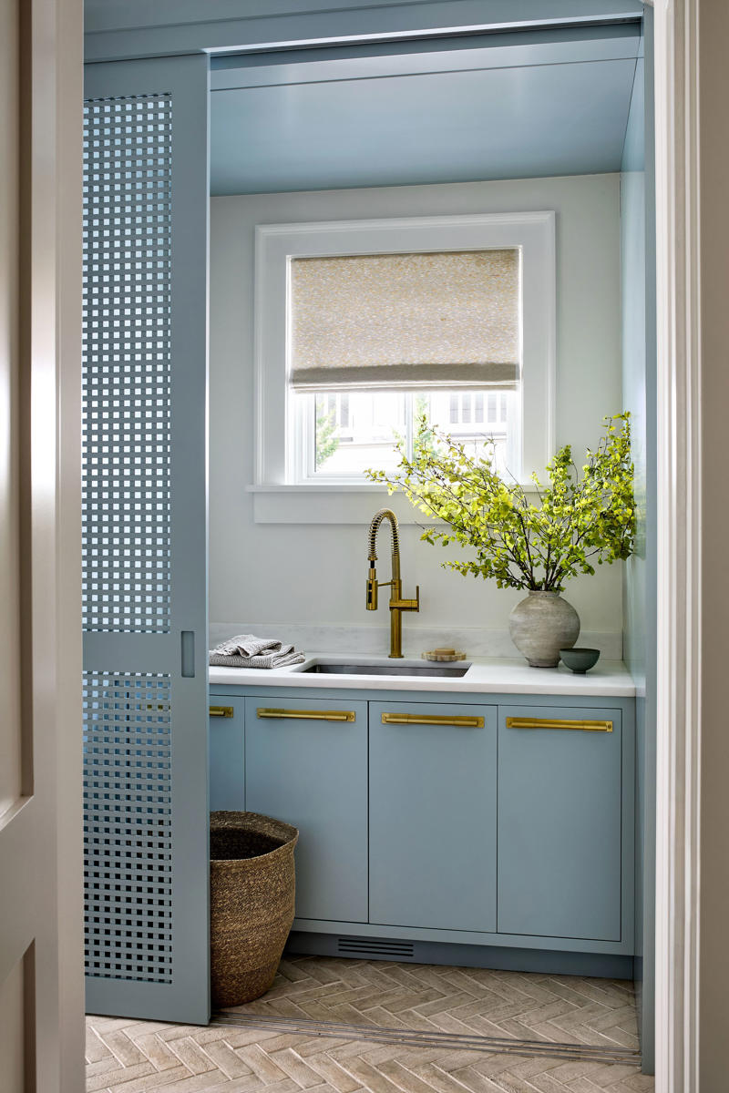 Embrace a color-drenching moment, Say yes to spray paint, Just add curtains, Nod to location, Work your vertical space, Don’t overlook the floor, Use a sliding door, Don’t hold back on detail, Add a clothing rod, Create a multiuse space, Add color with a bold wallpaper, Plan around storage, Don’t forget the art, Install high shelving, Put every flat surface to use, Incorporate hampers for easy organization, Put a drying rack on the wall, It’s okay to cover windows, Keep laundry materials out of sight, Create a dual mudroom, Built-in furniture is not the only path to success, Place pattern all over, Install a unique light fixture, Place cabinets on top of your washer/dryer, Add texture with cabinet fronts, Hide away your washer and dryer, Camouflage appliances, Go for sliding racks, Lean into neutrals, Add a countertop to a galley laundry room, Choose a vibrant color scheme, Play with geometry, Opt for moody elegance