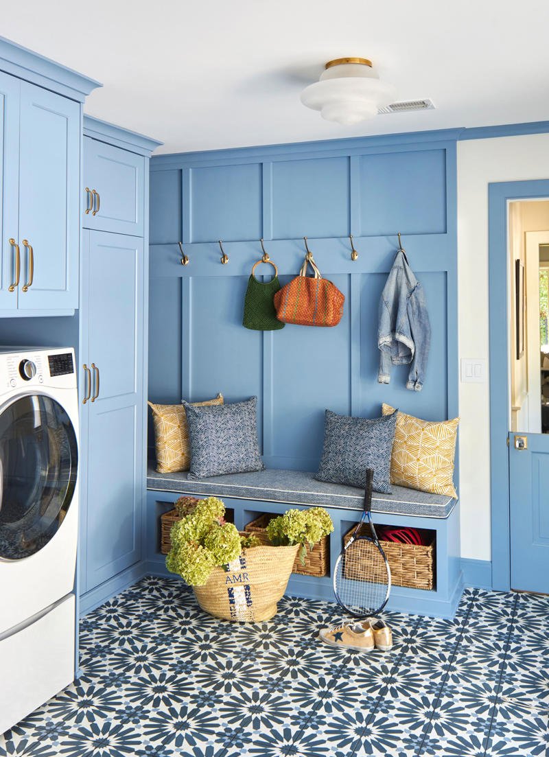 Embrace a color-drenching moment, Say yes to spray paint, Just add curtains, Nod to location, Work your vertical space, Don’t overlook the floor, Use a sliding door, Don’t hold back on detail, Add a clothing rod, Create a multiuse space, Add color with a bold wallpaper, Plan around storage, Don’t forget the art, Install high shelving, Put every flat surface to use, Incorporate hampers for easy organization, Put a drying rack on the wall, It’s okay to cover windows, Keep laundry materials out of sight, Create a dual mudroom, Built-in furniture is not the only path to success, Place pattern all over, Install a unique light fixture, Place cabinets on top of your washer/dryer, Add texture with cabinet fronts, Hide away your washer and dryer, Camouflage appliances, Go for sliding racks, Lean into neutrals, Add a countertop to a galley laundry room, Choose a vibrant color scheme, Play with geometry, Opt for moody elegance