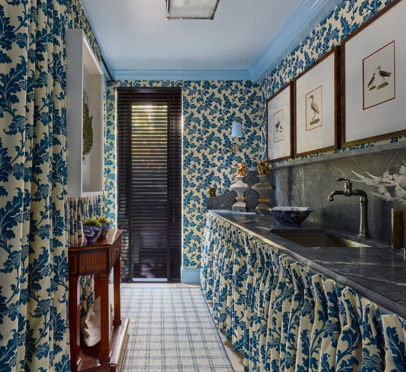 Embrace a color-drenching moment, Say yes to spray paint, Just add curtains, Nod to location, Work your vertical space, Don’t overlook the floor, Use a sliding door, Don’t hold back on detail, Add a clothing rod, Create a multiuse space, Add color with a bold wallpaper, Plan around storage, Don’t forget the art, Install high shelving, Put every flat surface to use, Incorporate hampers for easy organization, Put a drying rack on the wall, It’s okay to cover windows, Keep laundry materials out of sight, Create a dual mudroom, Built-in furniture is not the only path to success, Place pattern all over, Install a unique light fixture, Place cabinets on top of your washer/dryer, Add texture with cabinet fronts, Hide away your washer and dryer, Camouflage appliances, Go for sliding racks, Lean into neutrals, Add a countertop to a galley laundry room, Choose a vibrant color scheme, Play with geometry, Opt for moody elegance