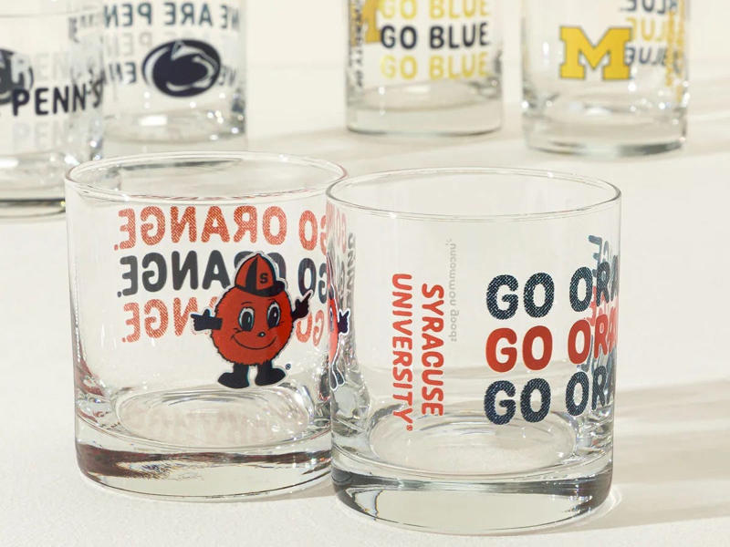 A set of glasses full of school spirit A starter watch, A pillow that pays homage to their alma mater, A stylish suitcase, A nice set of dinnerware, A history of their favorite football team, A set of glasses full of school spirit, The newest AirPods, A pleasant way to wake up every day, A toiletry bag to use at home or for travel, A fancy messenger bag, A made-to-measure suit, A handheld massager, A pair of joggers he can wear anywhere, A must-read financial guide book, A food delivery gift card, A customized business card holder, A wireless charging pad, An even easier way to make pasta, A durable mug made for camping and beyond, A new skincare routine, A small but powerful speaker, A speaker that talks to you, A fun mug, An Amazon gift card