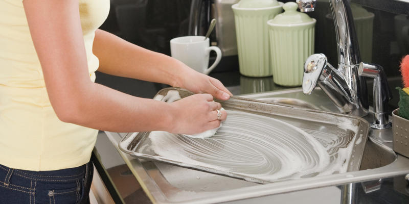 Use dish soap and water, Scrub with salt, Soak it in vinegar, Make a baking soda and hydrogen peroxide paste, Mix vinegar and lemon juice, Line your baking sheet to keep it clean, Insider's takeaway 