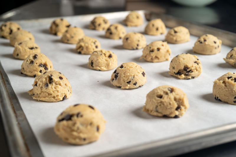 Use dish soap and water, Scrub with salt, Soak it in vinegar, Make a baking soda and hydrogen peroxide paste, Mix vinegar and lemon juice, Line your baking sheet to keep it clean, Insider's takeaway 