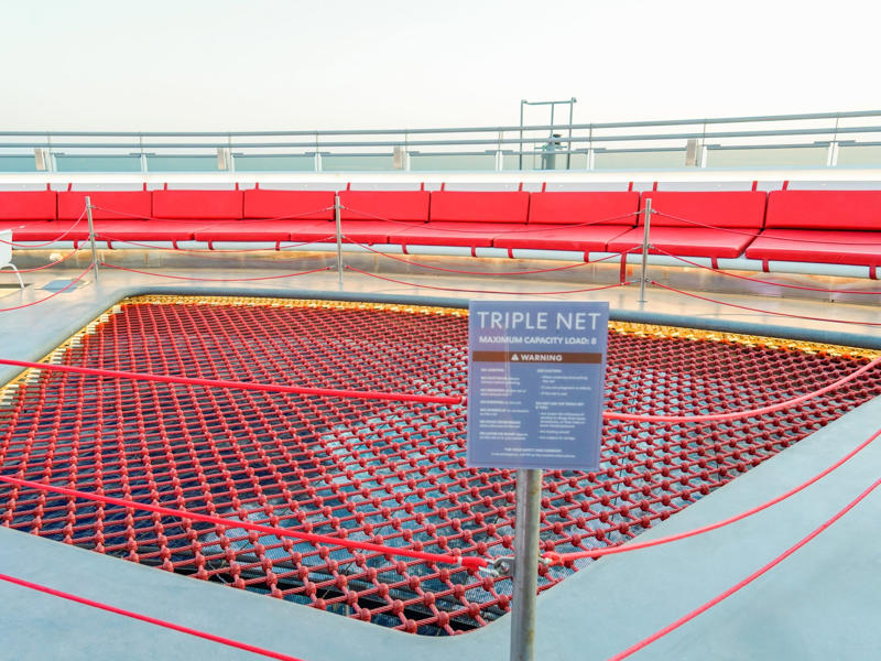 For thrill-seekers, there's a net you can walk — or crawl — around with a view of the ocean below. Upstairs, deck seven is a gamer's paradise., Deck seven also has an outdoor lounge known as the Dock., Decks eight to 14 hold nothing but staterooms., There was also a gym in the indoor portion of deck 15., I think you can get a more fun workout upstairs on deck 16., ... and a wide variety of games and sports, like a giant chessboard.