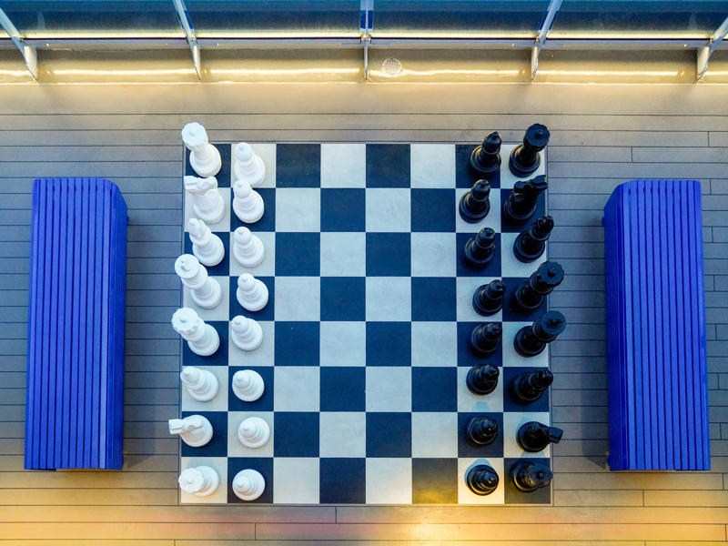... and a wide variety of games and sports, like a giant chessboard. Upstairs, deck seven is a gamer's paradise., Deck seven also has an outdoor lounge known as the Dock., Decks eight to 14 hold nothing but staterooms., There was also a gym in the indoor portion of deck 15., I think you can get a more fun workout upstairs on deck 16., ... and a wide variety of games and sports, like a giant chessboard.
