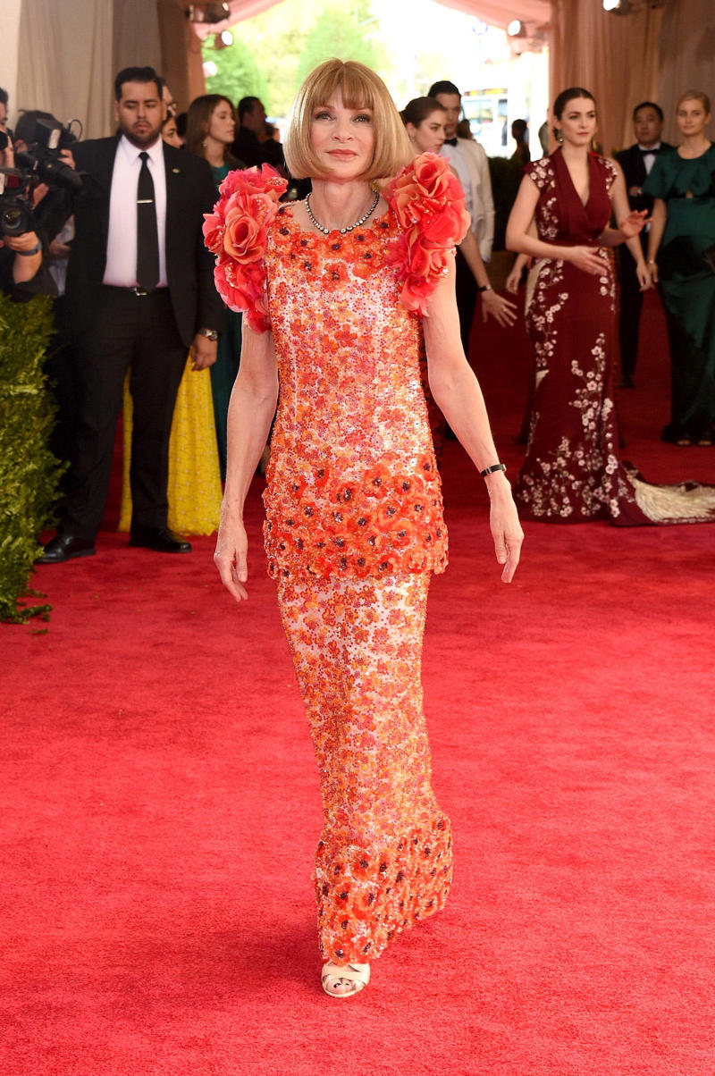 Wintour wore a sparkly gold top for the 1989 Met Gala., Wintour arrived in an angelic Christian Dior ensemble for the 2003 Met Gala., Wintour dazzled at the 2010 Met Gala in a silver-tiered Chanel dress., She returned to wearing Chanel at the 2022 Met Gala, emphasizing "Gilded Glamour."