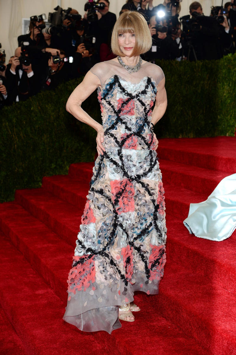 Wintour wore a sparkly gold top for the 1989 Met Gala., Wintour arrived in an angelic Christian Dior ensemble for the 2003 Met Gala., Wintour dazzled at the 2010 Met Gala in a silver-tiered Chanel dress., She returned to wearing Chanel at the 2022 Met Gala, emphasizing "Gilded Glamour."