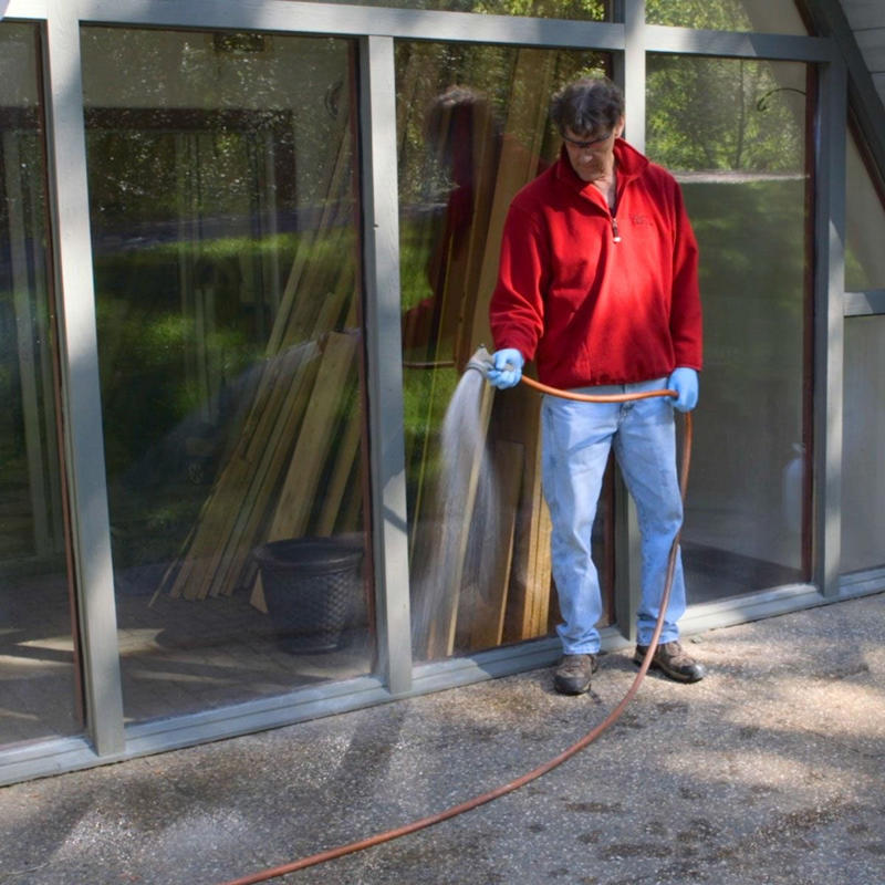 Power Wash the Slab, Load Up Pump Sprayer, dampening concrete, scrubbing concrete with stiff brush, soaking grass