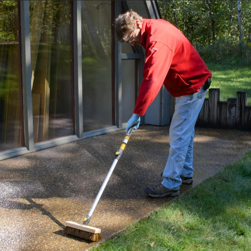 Power Wash the Slab, Load Up Pump Sprayer, dampening concrete, scrubbing concrete with stiff brush, soaking grass