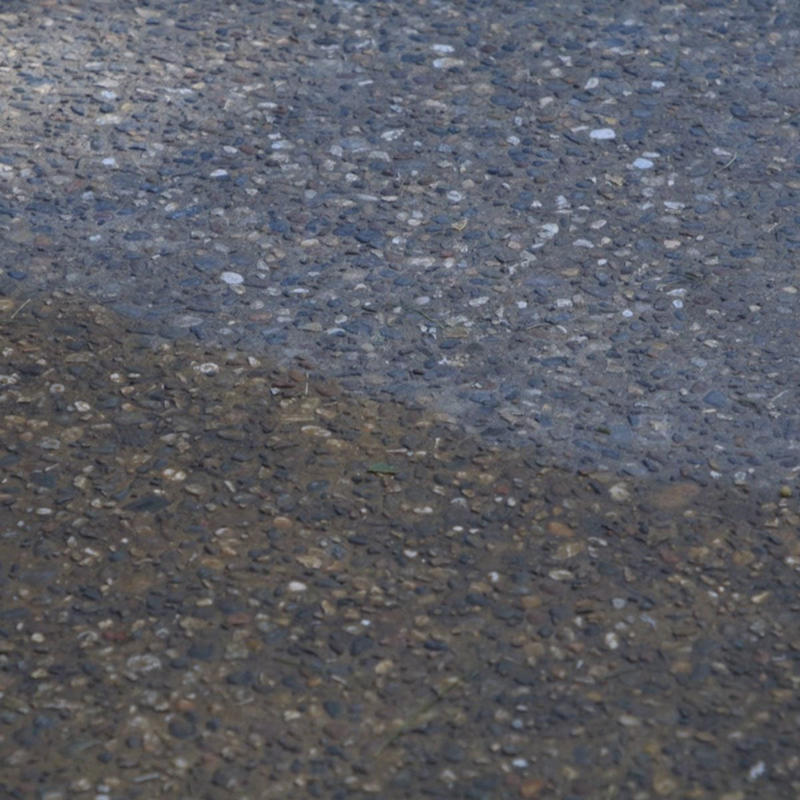 Power Wash the Slab, Load Up Pump Sprayer, dampening concrete, scrubbing concrete with stiff brush, soaking grass