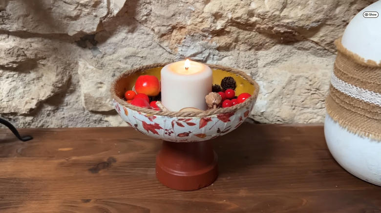 A decorative decoupage bowl, Hanging a decorated old frying pan, A tiny portable fire pit, Baking pan candle sconces, A vertical frying pan planter, Bundt cake pan planter, Sheet pan cookbook stand, Pizza pan wreath or sign