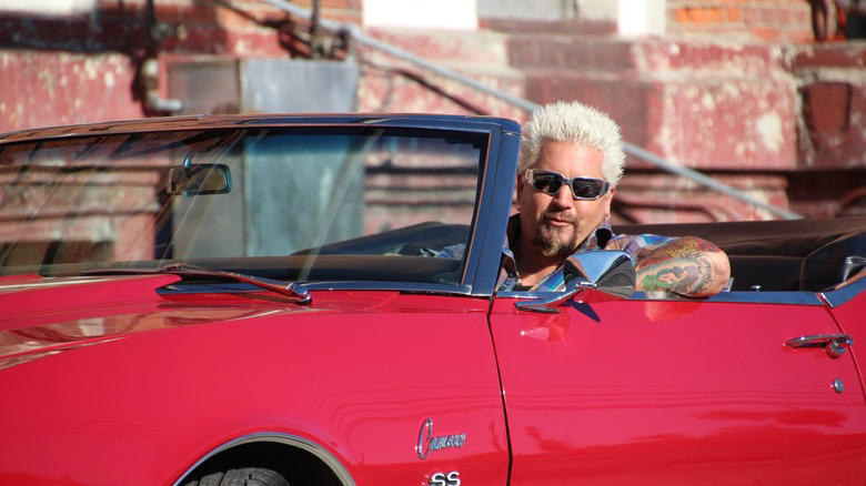1. Restaurants had to bear the cost of a visit, 2. Fieri was accused of making sexist and homophobic remarks, 3. A Diners, Drive-Ins and Dives producer sued Food Network, 4. Fieri wasn't able to hide when he didn't like something, 5. Many featured restaurants closed after the show's visit, 6. Fieri faced numerous lawsuits himself, 7. Fieri physically fought with his hairdresser, 8. Fieri famously feuded with Anthony Bourdain