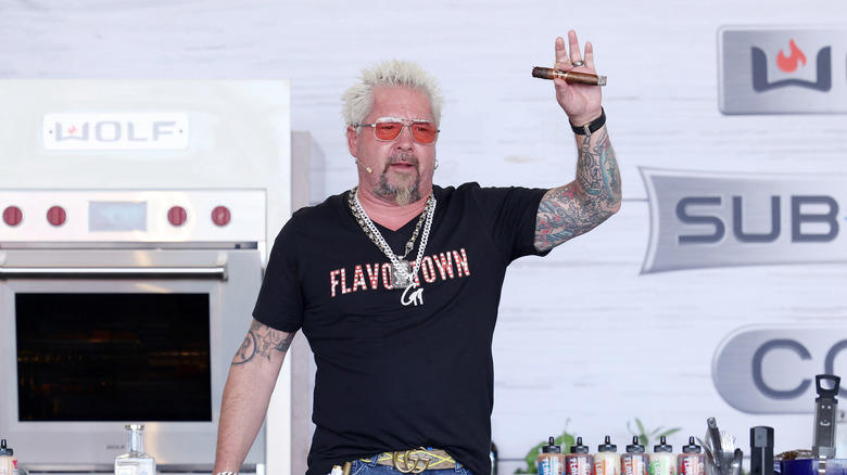 1. Restaurants had to bear the cost of a visit, 2. Fieri was accused of making sexist and homophobic remarks, 3. A Diners, Drive-Ins and Dives producer sued Food Network, 4. Fieri wasn't able to hide when he didn't like something, 5. Many featured restaurants closed after the show's visit, 6. Fieri faced numerous lawsuits himself, 7. Fieri physically fought with his hairdresser, 8. Fieri famously feuded with Anthony Bourdain