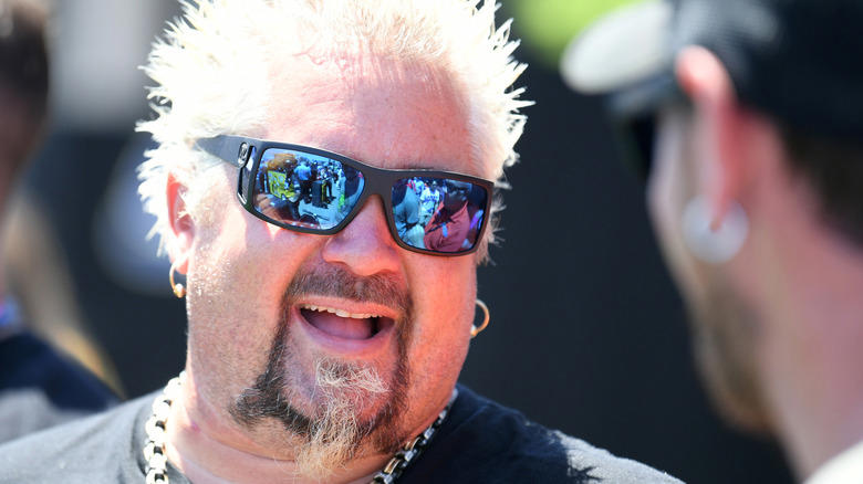1. Restaurants had to bear the cost of a visit, 2. Fieri was accused of making sexist and homophobic remarks, 3. A Diners, Drive-Ins and Dives producer sued Food Network, 4. Fieri wasn't able to hide when he didn't like something, 5. Many featured restaurants closed after the show's visit, 6. Fieri faced numerous lawsuits himself, 7. Fieri physically fought with his hairdresser, 8. Fieri famously feuded with Anthony Bourdain
