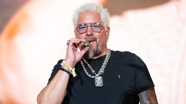 1. Restaurants had to bear the cost of a visit, 2. Fieri was accused of making sexist and homophobic remarks, 3. A Diners, Drive-Ins and Dives producer sued Food Network, 4. Fieri wasn't able to hide when he didn't like something, 5. Many featured restaurants closed after the show's visit, 6. Fieri faced numerous lawsuits himself, 7. Fieri physically fought with his hairdresser, 8. Fieri famously feuded with Anthony Bourdain