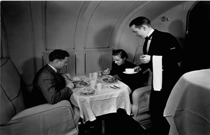 1940s: a couple enjoys dinner aboard the Boeing 314 A flight back in time, 1920s: the beginnings of air travel, 1920s: a passenger compartment from the 1920s, 1920s: inside a Transcontinental Air Transport plane, 1920s: bed compartments of a German Junker aircraft, 1920s: a flight attendant serves drinks on a French Airliner service, 1920s: an early German Deutsche Luft Hansa plane, 1920s: the Dornier Do X dining salon, 1920s: the first ever in-flight movie, 1920s: enjoying breakfast at 3,000 feet (914m), 1920s: passengers get weighed before their flight, 1930s: passengers climb aboard a plane at Croydon Airport, England, 1930s: crew members check bags before a flight to LA, 1930s: the check-in desk at newly opened Gatwick Airport, 1930s: an early plane with wicker seats, 1930s: the comfortable seats of a Handley Page HP42, 1930s: a plush Imperial Airways cabin, 1930s: passengers aboard the Douglas DC-1, 1930s: a flight attendant serves tea in bed, 1930s: ladies traveling on an Eastern Air Transport plane, 1930s: chefs load up a plane with homemade treats, 1930s: women in their finest attire wait to board a plane, 1930s: passengers listen to a broadcast aboard a flight, Early 1940s: passengers on board the Junkers G.38 plane, 1940s: day cabins inside an Imperial Airways flying boat, 1940s: interior of a McDonnell Douglas DC-6, 1940s: inside a Sikorsky S-40 flying boat, Late 1930s: the early days of Pan Am, 1940s: Pan American Airlines' Boeing 314 Clipper sets off, 1940s: inside the Boeing 314 flying boat, 1940s: it wasn't cheap to fly aboard the Boeing 314, 1940s: a couple enjoys dinner aboard the Boeing 314, 1940s: the early days of Heathrow Airport, 1940s: Boeing 307 Stratoliner's cocktail lounge, 1940s: the overnight intercontinental service onboard Boeing Stratocruiser, 1940s: the communal lounge aboard a Boeing aeroplane, 1950s: guests relax in an onboard lounge compartment, 1950s: the Sky-Cot aboard a British Overseas Airways Corporation flight, 1950s: a movie projector on a United Airlines flight