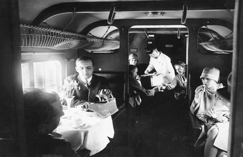 1920s: an early German Deutsche Luft Hansa plane A flight back in time, 1920s: the beginnings of air travel, 1920s: a passenger compartment from the 1920s, 1920s: inside a Transcontinental Air Transport plane, 1920s: bed compartments of a German Junker aircraft, 1920s: a flight attendant serves drinks on a French Airliner service, 1920s: an early German Deutsche Luft Hansa plane, 1920s: the Dornier Do X dining salon, 1920s: the first ever in-flight movie, 1920s: enjoying breakfast at 3,000 feet (914m), 1920s: passengers get weighed before their flight, 1930s: passengers climb aboard a plane at Croydon Airport, England, 1930s: crew members check bags before a flight to LA, 1930s: the check-in desk at newly opened Gatwick Airport, 1930s: an early plane with wicker seats, 1930s: the comfortable seats of a Handley Page HP42, 1930s: a plush Imperial Airways cabin, 1930s: passengers aboard the Douglas DC-1, 1930s: a flight attendant serves tea in bed, 1930s: ladies traveling on an Eastern Air Transport plane, 1930s: chefs load up a plane with homemade treats, 1930s: women in their finest attire wait to board a plane, 1930s: passengers listen to a broadcast aboard a flight, Early 1940s: passengers on board the Junkers G.38 plane, 1940s: day cabins inside an Imperial Airways flying boat, 1940s: interior of a McDonnell Douglas DC-6, 1940s: inside a Sikorsky S-40 flying boat, Late 1930s: the early days of Pan Am, 1940s: Pan American Airlines' Boeing 314 Clipper sets off, 1940s: inside the Boeing 314 flying boat, 1940s: it wasn't cheap to fly aboard the Boeing 314, 1940s: a couple enjoys dinner aboard the Boeing 314, 1940s: the early days of Heathrow Airport, 1940s: Boeing 307 Stratoliner's cocktail lounge, 1940s: the overnight intercontinental service onboard Boeing Stratocruiser, 1940s: the communal lounge aboard a Boeing aeroplane, 1950s: guests relax in an onboard lounge compartment, 1950s: the Sky-Cot aboard a British Overseas Airways Corporation flight, 1950s: a movie projector on a United Airlines flight