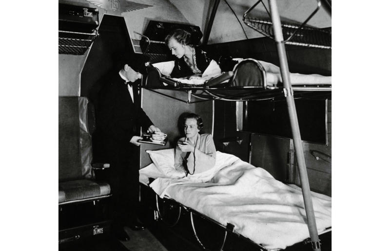 1930s: a flight attendant serves tea in bed A flight back in time, 1920s: the beginnings of air travel, 1920s: a passenger compartment from the 1920s, 1920s: inside a Transcontinental Air Transport plane, 1920s: bed compartments of a German Junker aircraft, 1920s: a flight attendant serves drinks on a French Airliner service, 1920s: an early German Deutsche Luft Hansa plane, 1920s: the Dornier Do X dining salon, 1920s: the first ever in-flight movie, 1920s: enjoying breakfast at 3,000 feet (914m), 1920s: passengers get weighed before their flight, 1930s: passengers climb aboard a plane at Croydon Airport, England, 1930s: crew members check bags before a flight to LA, 1930s: the check-in desk at newly opened Gatwick Airport, 1930s: an early plane with wicker seats, 1930s: the comfortable seats of a Handley Page HP42, 1930s: a plush Imperial Airways cabin, 1930s: passengers aboard the Douglas DC-1, 1930s: a flight attendant serves tea in bed, 1930s: ladies traveling on an Eastern Air Transport plane, 1930s: chefs load up a plane with homemade treats, 1930s: women in their finest attire wait to board a plane, 1930s: passengers listen to a broadcast aboard a flight, Early 1940s: passengers on board the Junkers G.38 plane, 1940s: day cabins inside an Imperial Airways flying boat, 1940s: interior of a McDonnell Douglas DC-6, 1940s: inside a Sikorsky S-40 flying boat, Late 1930s: the early days of Pan Am, 1940s: Pan American Airlines' Boeing 314 Clipper sets off, 1940s: inside the Boeing 314 flying boat, 1940s: it wasn't cheap to fly aboard the Boeing 314, 1940s: a couple enjoys dinner aboard the Boeing 314, 1940s: the early days of Heathrow Airport, 1940s: Boeing 307 Stratoliner's cocktail lounge, 1940s: the overnight intercontinental service onboard Boeing Stratocruiser, 1940s: the communal lounge aboard a Boeing aeroplane, 1950s: guests relax in an onboard lounge compartment, 1950s: the Sky-Cot aboard a British Overseas Airways Corporation flight, 1950s: a movie projector on a United Airlines flight
