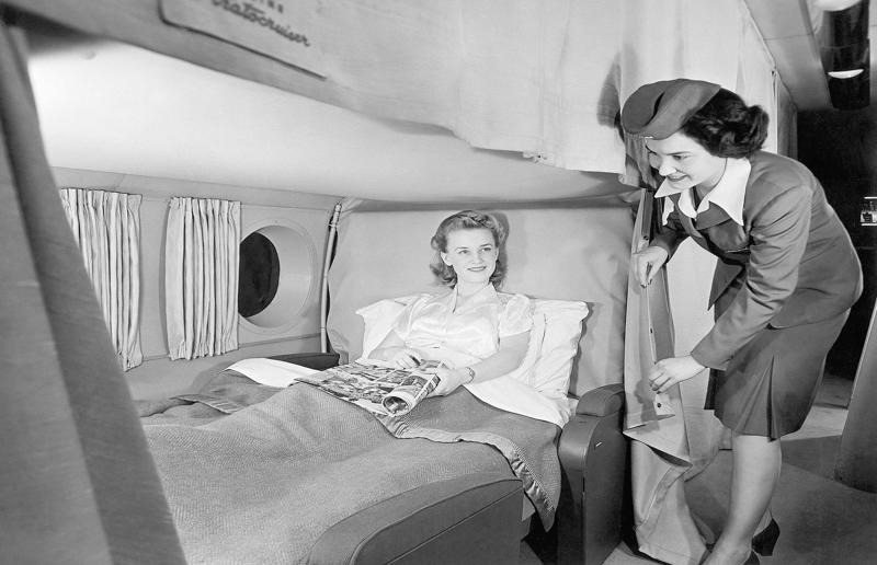 1940s: the overnight intercontinental service onboard Boeing Stratocruiser A flight back in time, 1920s: the beginnings of air travel, 1920s: a passenger compartment from the 1920s, 1920s: inside a Transcontinental Air Transport plane, 1920s: bed compartments of a German Junker aircraft, 1920s: a flight attendant serves drinks on a French Airliner service, 1920s: an early German Deutsche Luft Hansa plane, 1920s: the Dornier Do X dining salon, 1920s: the first ever in-flight movie, 1920s: enjoying breakfast at 3,000 feet (914m), 1920s: passengers get weighed before their flight, 1930s: passengers climb aboard a plane at Croydon Airport, England, 1930s: crew members check bags before a flight to LA, 1930s: the check-in desk at newly opened Gatwick Airport, 1930s: an early plane with wicker seats, 1930s: the comfortable seats of a Handley Page HP42, 1930s: a plush Imperial Airways cabin, 1930s: passengers aboard the Douglas DC-1, 1930s: a flight attendant serves tea in bed, 1930s: ladies traveling on an Eastern Air Transport plane, 1930s: chefs load up a plane with homemade treats, 1930s: women in their finest attire wait to board a plane, 1930s: passengers listen to a broadcast aboard a flight, Early 1940s: passengers on board the Junkers G.38 plane, 1940s: day cabins inside an Imperial Airways flying boat, 1940s: interior of a McDonnell Douglas DC-6, 1940s: inside a Sikorsky S-40 flying boat, Late 1930s: the early days of Pan Am, 1940s: Pan American Airlines' Boeing 314 Clipper sets off, 1940s: inside the Boeing 314 flying boat, 1940s: it wasn't cheap to fly aboard the Boeing 314, 1940s: a couple enjoys dinner aboard the Boeing 314, 1940s: the early days of Heathrow Airport, 1940s: Boeing 307 Stratoliner's cocktail lounge, 1940s: the overnight intercontinental service onboard Boeing Stratocruiser, 1940s: the communal lounge aboard a Boeing aeroplane, 1950s: guests relax in an onboard lounge compartment, 1950s: the Sky-Cot aboard a British Overseas Airways Corporation flight, 1950s: a movie projector on a United Airlines flight
