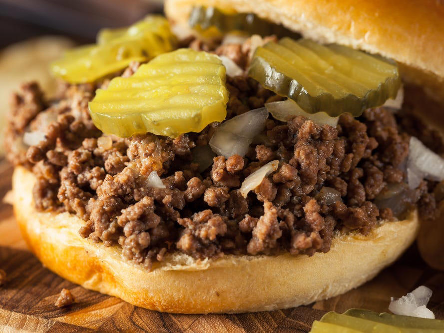 IOWA: A Tavern or ALABAMA: A chicken sandwich with white barbecue sauce, ALASKA: A wild Alaskan salmon sandwich, ARIZONA: Frybread tacos, ARKANSAS: A deep-fried catfish sandwich, CALIFORNIA: An avocado club sandwich, COLORADO: A Denver sandwich, CONNECTICUT: A Connecticut hamburger, DELAWARE: A soft-shell fried crab sandwich, FLORIDA: A Cuban sandwich, GEORGIA: A fried chicken sandwich, HAWAII: A Kālua-style pork sandwich, ILLINOIS: A Horseshoe sandwich, INDIANA: A Hoosier sandwich, IOWA: A Tavern or "loose meat" sandwich, KANSAS: "Runza" or "bierocks", KENTUCKY: A Hot Brown sandwich, LOUISIANA: A po'boy, MARYLAND: A crab-cake sandwich, MASSACHUSETTS: A Fluffernutter, MICHIGAN: A corned beef sandwich, MINNESOTA: A Jucy Lucy, MISSISSIPPI: A pig-ear sandwich, MISSOURI: A Gerber sandwich, MONTANA: A PB&J with huckleberry jam, NEBRASKA: A Reuben, NEVADA: A Heart Attack Grill burger, NEW HAMPSHIRE: A fried ham and cheese Monte Cristo drizzled with syrup, NEW JERSEY: A Jersey breakfast sandwich, NEW MEXICO: A green chile cheeseburger, NORTH CAROLINA: A pulled-pork sandwich, NORTH DAKOTA: Smørbrød, OHIO: A Polish boy, OKLAHOMA: A chicken-fried steak sandwich, OREGON: A falafel pita, PENNSYLVANIA: A Philly cheesesteak, RHODE ISLAND: A Dynamite sandwich, SOUTH CAROLINA: A tuna melt, SOUTH DAKOTA: A walleye sandwich, TENNESSEE: A Fluffernutter, TEXAS: A brisket sandwich, UTAH: A pastrami burger, VERMONT: A Vermonter, VIRGINIA: A grilled ham and cheese, WASHINGTON: Bánh mì, WEST VIRGINIA: An apple and turkey sandwich, WISCONSIN: A sausage roll or brat bun, WYOMING: A bison meatball sandwich