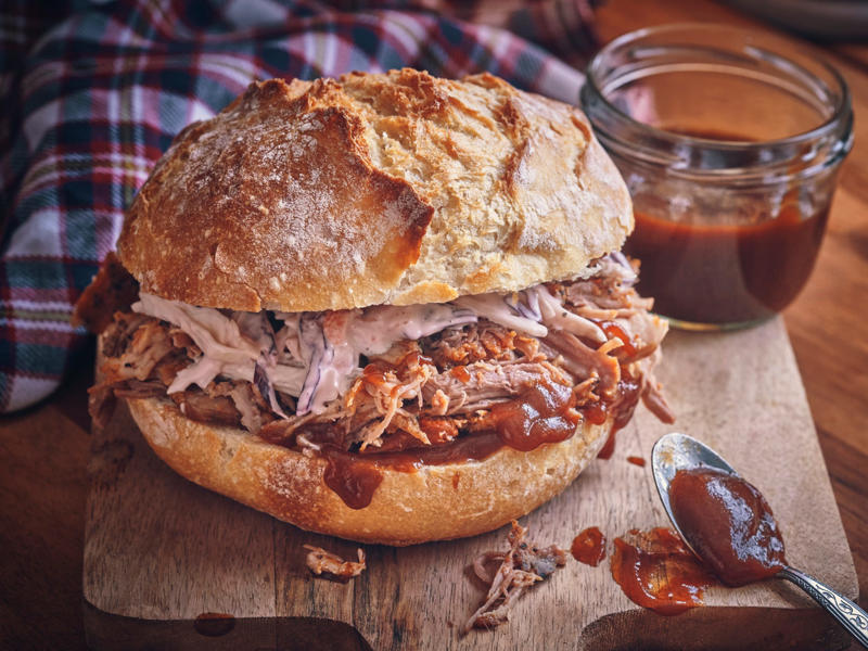 NORTH CAROLINA: A pulled pork sandwich ALABAMA: A chicken sandwich with white barbecue sauce, ALASKA: A wild Alaskan salmon sandwich, ARIZONA: Frybread tacos, ARKANSAS: A deep-fried catfish sandwich, CALIFORNIA: An avocado club sandwich, COLORADO: A Denver sandwich, CONNECTICUT: A Connecticut hamburger, DELAWARE: A soft-shell fried crab sandwich, FLORIDA: A Cuban sandwich, GEORGIA: A fried chicken sandwich, HAWAII: A Kālua-style pork sandwich, ILLINOIS: A Horseshoe sandwich, INDIANA: A Hoosier sandwich, IOWA: A Tavern or "loose meat" sandwich, KANSAS: "Runza" or "bierocks", KENTUCKY: A Hot Brown sandwich, LOUISIANA: A po'boy, MARYLAND: A crab-cake sandwich, MASSACHUSETTS: A Fluffernutter, MICHIGAN: A corned beef sandwich, MINNESOTA: A Jucy Lucy, MISSISSIPPI: A pig-ear sandwich, MISSOURI: A Gerber sandwich, MONTANA: A PB&J with huckleberry jam, NEBRASKA: A Reuben, NEVADA: A Heart Attack Grill burger, NEW HAMPSHIRE: A fried ham and cheese Monte Cristo drizzled with syrup, NEW JERSEY: A Jersey breakfast sandwich, NEW MEXICO: A green chile cheeseburger, NORTH CAROLINA: A pulled-pork sandwich, NORTH DAKOTA: Smørbrød, OHIO: A Polish boy, OKLAHOMA: A chicken-fried steak sandwich, OREGON: A falafel pita, PENNSYLVANIA: A Philly cheesesteak, RHODE ISLAND: A Dynamite sandwich, SOUTH CAROLINA: A tuna melt, SOUTH DAKOTA: A walleye sandwich, TENNESSEE: A Fluffernutter, TEXAS: A brisket sandwich, UTAH: A pastrami burger, VERMONT: A Vermonter, VIRGINIA: A grilled ham and cheese, WASHINGTON: Bánh mì, WEST VIRGINIA: An apple and turkey sandwich, WISCONSIN: A sausage roll or brat bun, WYOMING: A bison meatball sandwich