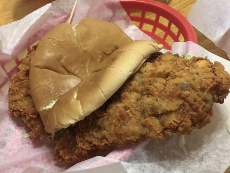 OKLAHOMA: A chicken-fried steak sandwich ALABAMA: A chicken sandwich with white barbecue sauce, ALASKA: A wild Alaskan salmon sandwich, ARIZONA: Frybread tacos, ARKANSAS: A deep-fried catfish sandwich, CALIFORNIA: An avocado club sandwich, COLORADO: A Denver sandwich, CONNECTICUT: A Connecticut hamburger, DELAWARE: A soft-shell fried crab sandwich, FLORIDA: A Cuban sandwich, GEORGIA: A fried chicken sandwich, HAWAII: A Kālua-style pork sandwich, ILLINOIS: A Horseshoe sandwich, INDIANA: A Hoosier sandwich, IOWA: A Tavern or "loose meat" sandwich, KANSAS: "Runza" or "bierocks", KENTUCKY: A Hot Brown sandwich, LOUISIANA: A po'boy, MARYLAND: A crab-cake sandwich, MASSACHUSETTS: A Fluffernutter, MICHIGAN: A corned beef sandwich, MINNESOTA: A Jucy Lucy, MISSISSIPPI: A pig-ear sandwich, MISSOURI: A Gerber sandwich, MONTANA: A PB&J with huckleberry jam, NEBRASKA: A Reuben, NEVADA: A Heart Attack Grill burger, NEW HAMPSHIRE: A fried ham and cheese Monte Cristo drizzled with syrup, NEW JERSEY: A Jersey breakfast sandwich, NEW MEXICO: A green chile cheeseburger, NORTH CAROLINA: A pulled-pork sandwich, NORTH DAKOTA: Smørbrød, OHIO: A Polish boy, OKLAHOMA: A chicken-fried steak sandwich, OREGON: A falafel pita, PENNSYLVANIA: A Philly cheesesteak, RHODE ISLAND: A Dynamite sandwich, SOUTH CAROLINA: A tuna melt, SOUTH DAKOTA: A walleye sandwich, TENNESSEE: A Fluffernutter, TEXAS: A brisket sandwich, UTAH: A pastrami burger, VERMONT: A Vermonter, VIRGINIA: A grilled ham and cheese, WASHINGTON: Bánh mì, WEST VIRGINIA: An apple and turkey sandwich, WISCONSIN: A sausage roll or brat bun, WYOMING: A bison meatball sandwich