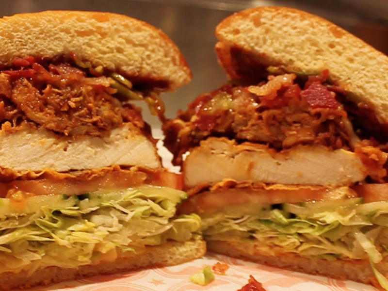 GEORGIA: A fried chicken sandwich ALABAMA: A chicken sandwich with white barbecue sauce, ALASKA: A wild Alaskan salmon sandwich, ARIZONA: Frybread tacos, ARKANSAS: A deep-fried catfish sandwich, CALIFORNIA: An avocado club sandwich, COLORADO: A Denver sandwich, CONNECTICUT: A Connecticut hamburger, DELAWARE: A soft-shell fried crab sandwich, FLORIDA: A Cuban sandwich, GEORGIA: A fried chicken sandwich, HAWAII: A Kālua-style pork sandwich, ILLINOIS: A Horseshoe sandwich, INDIANA: A Hoosier sandwich, IOWA: A Tavern or "loose meat" sandwich, KANSAS: "Runza" or "bierocks", KENTUCKY: A Hot Brown sandwich, LOUISIANA: A po'boy, MARYLAND: A crab-cake sandwich, MASSACHUSETTS: A Fluffernutter, MICHIGAN: A corned beef sandwich, MINNESOTA: A Jucy Lucy, MISSISSIPPI: A pig-ear sandwich, MISSOURI: A Gerber sandwich, MONTANA: A PB&J with huckleberry jam, NEBRASKA: A Reuben, NEVADA: A Heart Attack Grill burger, NEW HAMPSHIRE: A fried ham and cheese Monte Cristo drizzled with syrup, NEW JERSEY: A Jersey breakfast sandwich, NEW MEXICO: A green chile cheeseburger, NORTH CAROLINA: A pulled-pork sandwich, NORTH DAKOTA: Smørbrød, OHIO: A Polish boy, OKLAHOMA: A chicken-fried steak sandwich, OREGON: A falafel pita, PENNSYLVANIA: A Philly cheesesteak, RHODE ISLAND: A Dynamite sandwich, SOUTH CAROLINA: A tuna melt, SOUTH DAKOTA: A walleye sandwich, TENNESSEE: A Fluffernutter, TEXAS: A brisket sandwich, UTAH: A pastrami burger, VERMONT: A Vermonter, VIRGINIA: A grilled ham and cheese, WASHINGTON: Bánh mì, WEST VIRGINIA: An apple and turkey sandwich, WISCONSIN: A sausage roll or brat bun, WYOMING: A bison meatball sandwich