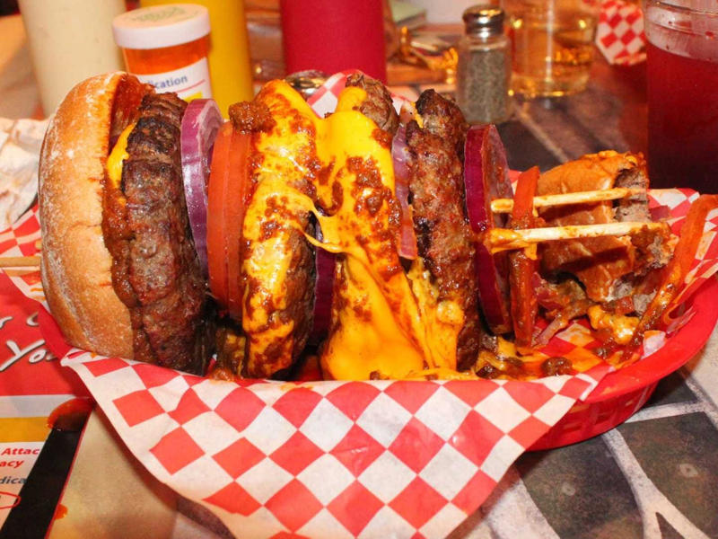 NEVADA: A Heart Attack Grill burger ALABAMA: A chicken sandwich with white barbecue sauce, ALASKA: A wild Alaskan salmon sandwich, ARIZONA: Frybread tacos, ARKANSAS: A deep-fried catfish sandwich, CALIFORNIA: An avocado club sandwich, COLORADO: A Denver sandwich, CONNECTICUT: A Connecticut hamburger, DELAWARE: A soft-shell fried crab sandwich, FLORIDA: A Cuban sandwich, GEORGIA: A fried chicken sandwich, HAWAII: A Kālua-style pork sandwich, ILLINOIS: A Horseshoe sandwich, INDIANA: A Hoosier sandwich, IOWA: A Tavern or "loose meat" sandwich, KANSAS: "Runza" or "bierocks", KENTUCKY: A Hot Brown sandwich, LOUISIANA: A po'boy, MARYLAND: A crab-cake sandwich, MASSACHUSETTS: A Fluffernutter, MICHIGAN: A corned beef sandwich, MINNESOTA: A Jucy Lucy, MISSISSIPPI: A pig-ear sandwich, MISSOURI: A Gerber sandwich, MONTANA: A PB&J with huckleberry jam, NEBRASKA: A Reuben, NEVADA: A Heart Attack Grill burger, NEW HAMPSHIRE: A fried ham and cheese Monte Cristo drizzled with syrup, NEW JERSEY: A Jersey breakfast sandwich, NEW MEXICO: A green chile cheeseburger, NORTH CAROLINA: A pulled-pork sandwich, NORTH DAKOTA: Smørbrød, OHIO: A Polish boy, OKLAHOMA: A chicken-fried steak sandwich, OREGON: A falafel pita, PENNSYLVANIA: A Philly cheesesteak, RHODE ISLAND: A Dynamite sandwich, SOUTH CAROLINA: A tuna melt, SOUTH DAKOTA: A walleye sandwich, TENNESSEE: A Fluffernutter, TEXAS: A brisket sandwich, UTAH: A pastrami burger, VERMONT: A Vermonter, VIRGINIA: A grilled ham and cheese, WASHINGTON: Bánh mì, WEST VIRGINIA: An apple and turkey sandwich, WISCONSIN: A sausage roll or brat bun, WYOMING: A bison meatball sandwich