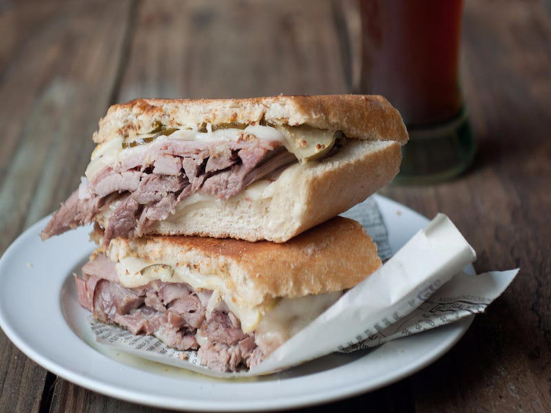 FLORIDA: A Cuban sandwich ALABAMA: A chicken sandwich with white barbecue sauce, ALASKA: A wild Alaskan salmon sandwich, ARIZONA: Frybread tacos, ARKANSAS: A deep-fried catfish sandwich, CALIFORNIA: An avocado club sandwich, COLORADO: A Denver sandwich, CONNECTICUT: A Connecticut hamburger, DELAWARE: A soft-shell fried crab sandwich, FLORIDA: A Cuban sandwich, GEORGIA: A fried chicken sandwich, HAWAII: A Kālua-style pork sandwich, ILLINOIS: A Horseshoe sandwich, INDIANA: A Hoosier sandwich, IOWA: A Tavern or "loose meat" sandwich, KANSAS: "Runza" or "bierocks", KENTUCKY: A Hot Brown sandwich, LOUISIANA: A po'boy, MARYLAND: A crab-cake sandwich, MASSACHUSETTS: A Fluffernutter, MICHIGAN: A corned beef sandwich, MINNESOTA: A Jucy Lucy, MISSISSIPPI: A pig-ear sandwich, MISSOURI: A Gerber sandwich, MONTANA: A PB&J with huckleberry jam, NEBRASKA: A Reuben, NEVADA: A Heart Attack Grill burger, NEW HAMPSHIRE: A fried ham and cheese Monte Cristo drizzled with syrup, NEW JERSEY: A Jersey breakfast sandwich, NEW MEXICO: A green chile cheeseburger, NORTH CAROLINA: A pulled-pork sandwich, NORTH DAKOTA: Smørbrød, OHIO: A Polish boy, OKLAHOMA: A chicken-fried steak sandwich, OREGON: A falafel pita, PENNSYLVANIA: A Philly cheesesteak, RHODE ISLAND: A Dynamite sandwich, SOUTH CAROLINA: A tuna melt, SOUTH DAKOTA: A walleye sandwich, TENNESSEE: A Fluffernutter, TEXAS: A brisket sandwich, UTAH: A pastrami burger, VERMONT: A Vermonter, VIRGINIA: A grilled ham and cheese, WASHINGTON: Bánh mì, WEST VIRGINIA: An apple and turkey sandwich, WISCONSIN: A sausage roll or brat bun, WYOMING: A bison meatball sandwich