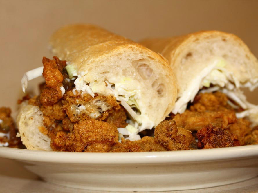 LOUISIANA: A po' boy ALABAMA: A chicken sandwich with white barbecue sauce, ALASKA: A wild Alaskan salmon sandwich, ARIZONA: Frybread tacos, ARKANSAS: A deep-fried catfish sandwich, CALIFORNIA: An avocado club sandwich, COLORADO: A Denver sandwich, CONNECTICUT: A Connecticut hamburger, DELAWARE: A soft-shell fried crab sandwich, FLORIDA: A Cuban sandwich, GEORGIA: A fried chicken sandwich, HAWAII: A Kālua-style pork sandwich, ILLINOIS: A Horseshoe sandwich, INDIANA: A Hoosier sandwich, IOWA: A Tavern or "loose meat" sandwich, KANSAS: "Runza" or "bierocks", KENTUCKY: A Hot Brown sandwich, LOUISIANA: A po'boy, MARYLAND: A crab-cake sandwich, MASSACHUSETTS: A Fluffernutter, MICHIGAN: A corned beef sandwich, MINNESOTA: A Jucy Lucy, MISSISSIPPI: A pig-ear sandwich, MISSOURI: A Gerber sandwich, MONTANA: A PB&J with huckleberry jam, NEBRASKA: A Reuben, NEVADA: A Heart Attack Grill burger, NEW HAMPSHIRE: A fried ham and cheese Monte Cristo drizzled with syrup, NEW JERSEY: A Jersey breakfast sandwich, NEW MEXICO: A green chile cheeseburger, NORTH CAROLINA: A pulled-pork sandwich, NORTH DAKOTA: Smørbrød, OHIO: A Polish boy, OKLAHOMA: A chicken-fried steak sandwich, OREGON: A falafel pita, PENNSYLVANIA: A Philly cheesesteak, RHODE ISLAND: A Dynamite sandwich, SOUTH CAROLINA: A tuna melt, SOUTH DAKOTA: A walleye sandwich, TENNESSEE: A Fluffernutter, TEXAS: A brisket sandwich, UTAH: A pastrami burger, VERMONT: A Vermonter, VIRGINIA: A grilled ham and cheese, WASHINGTON: Bánh mì, WEST VIRGINIA: An apple and turkey sandwich, WISCONSIN: A sausage roll or brat bun, WYOMING: A bison meatball sandwich