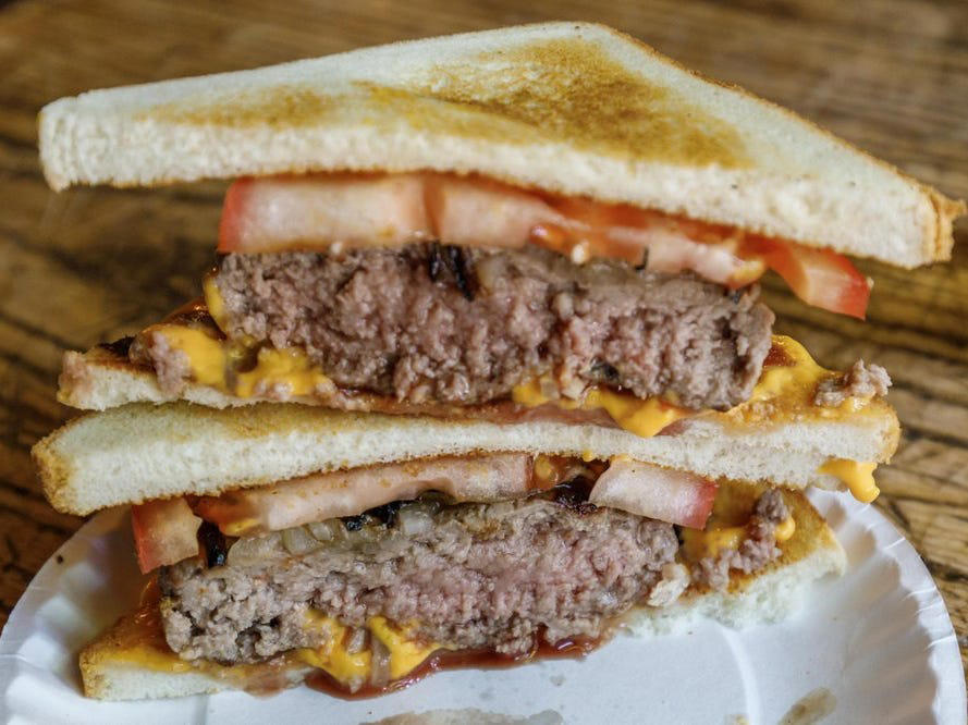 CONNECTICUT: A Connecticut hamburger ALABAMA: A chicken sandwich with white barbecue sauce, ALASKA: A wild Alaskan salmon sandwich, ARIZONA: Frybread tacos, ARKANSAS: A deep-fried catfish sandwich, CALIFORNIA: An avocado club sandwich, COLORADO: A Denver sandwich, CONNECTICUT: A Connecticut hamburger, DELAWARE: A soft-shell fried crab sandwich, FLORIDA: A Cuban sandwich, GEORGIA: A fried chicken sandwich, HAWAII: A Kālua-style pork sandwich, ILLINOIS: A Horseshoe sandwich, INDIANA: A Hoosier sandwich, IOWA: A Tavern or "loose meat" sandwich, KANSAS: "Runza" or "bierocks", KENTUCKY: A Hot Brown sandwich, LOUISIANA: A po'boy, MARYLAND: A crab-cake sandwich, MASSACHUSETTS: A Fluffernutter, MICHIGAN: A corned beef sandwich, MINNESOTA: A Jucy Lucy, MISSISSIPPI: A pig-ear sandwich, MISSOURI: A Gerber sandwich, MONTANA: A PB&J with huckleberry jam, NEBRASKA: A Reuben, NEVADA: A Heart Attack Grill burger, NEW HAMPSHIRE: A fried ham and cheese Monte Cristo drizzled with syrup, NEW JERSEY: A Jersey breakfast sandwich, NEW MEXICO: A green chile cheeseburger, NORTH CAROLINA: A pulled-pork sandwich, NORTH DAKOTA: Smørbrød, OHIO: A Polish boy, OKLAHOMA: A chicken-fried steak sandwich, OREGON: A falafel pita, PENNSYLVANIA: A Philly cheesesteak, RHODE ISLAND: A Dynamite sandwich, SOUTH CAROLINA: A tuna melt, SOUTH DAKOTA: A walleye sandwich, TENNESSEE: A Fluffernutter, TEXAS: A brisket sandwich, UTAH: A pastrami burger, VERMONT: A Vermonter, VIRGINIA: A grilled ham and cheese, WASHINGTON: Bánh mì, WEST VIRGINIA: An apple and turkey sandwich, WISCONSIN: A sausage roll or brat bun, WYOMING: A bison meatball sandwich