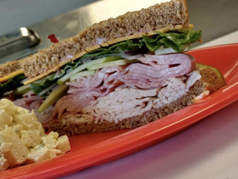 VERMONT: A Vermonter ALABAMA: A chicken sandwich with white barbecue sauce, ALASKA: A wild Alaskan salmon sandwich, ARIZONA: Frybread tacos, ARKANSAS: A deep-fried catfish sandwich, CALIFORNIA: An avocado club sandwich, COLORADO: A Denver sandwich, CONNECTICUT: A Connecticut hamburger, DELAWARE: A soft-shell fried crab sandwich, FLORIDA: A Cuban sandwich, GEORGIA: A fried chicken sandwich, HAWAII: A Kālua-style pork sandwich, ILLINOIS: A Horseshoe sandwich, INDIANA: A Hoosier sandwich, IOWA: A Tavern or "loose meat" sandwich, KANSAS: "Runza" or "bierocks", KENTUCKY: A Hot Brown sandwich, LOUISIANA: A po'boy, MARYLAND: A crab-cake sandwich, MASSACHUSETTS: A Fluffernutter, MICHIGAN: A corned beef sandwich, MINNESOTA: A Jucy Lucy, MISSISSIPPI: A pig-ear sandwich, MISSOURI: A Gerber sandwich, MONTANA: A PB&J with huckleberry jam, NEBRASKA: A Reuben, NEVADA: A Heart Attack Grill burger, NEW HAMPSHIRE: A fried ham and cheese Monte Cristo drizzled with syrup, NEW JERSEY: A Jersey breakfast sandwich, NEW MEXICO: A green chile cheeseburger, NORTH CAROLINA: A pulled-pork sandwich, NORTH DAKOTA: Smørbrød, OHIO: A Polish boy, OKLAHOMA: A chicken-fried steak sandwich, OREGON: A falafel pita, PENNSYLVANIA: A Philly cheesesteak, RHODE ISLAND: A Dynamite sandwich, SOUTH CAROLINA: A tuna melt, SOUTH DAKOTA: A walleye sandwich, TENNESSEE: A Fluffernutter, TEXAS: A brisket sandwich, UTAH: A pastrami burger, VERMONT: A Vermonter, VIRGINIA: A grilled ham and cheese, WASHINGTON: Bánh mì, WEST VIRGINIA: An apple and turkey sandwich, WISCONSIN: A sausage roll or brat bun, WYOMING: A bison meatball sandwich