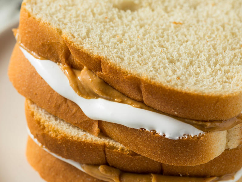 MASSACHUSETTS: A Fluffernutter ALABAMA: A chicken sandwich with white barbecue sauce, ALASKA: A wild Alaskan salmon sandwich, ARIZONA: Frybread tacos, ARKANSAS: A deep-fried catfish sandwich, CALIFORNIA: An avocado club sandwich, COLORADO: A Denver sandwich, CONNECTICUT: A Connecticut hamburger, DELAWARE: A soft-shell fried crab sandwich, FLORIDA: A Cuban sandwich, GEORGIA: A fried chicken sandwich, HAWAII: A Kālua-style pork sandwich, ILLINOIS: A Horseshoe sandwich, INDIANA: A Hoosier sandwich, IOWA: A Tavern or "loose meat" sandwich, KANSAS: "Runza" or "bierocks", KENTUCKY: A Hot Brown sandwich, LOUISIANA: A po'boy, MARYLAND: A crab-cake sandwich, MASSACHUSETTS: A Fluffernutter, MICHIGAN: A corned beef sandwich, MINNESOTA: A Jucy Lucy, MISSISSIPPI: A pig-ear sandwich, MISSOURI: A Gerber sandwich, MONTANA: A PB&J with huckleberry jam, NEBRASKA: A Reuben, NEVADA: A Heart Attack Grill burger, NEW HAMPSHIRE: A fried ham and cheese Monte Cristo drizzled with syrup, NEW JERSEY: A Jersey breakfast sandwich, NEW MEXICO: A green chile cheeseburger, NORTH CAROLINA: A pulled-pork sandwich, NORTH DAKOTA: Smørbrød, OHIO: A Polish boy, OKLAHOMA: A chicken-fried steak sandwich, OREGON: A falafel pita, PENNSYLVANIA: A Philly cheesesteak, RHODE ISLAND: A Dynamite sandwich, SOUTH CAROLINA: A tuna melt, SOUTH DAKOTA: A walleye sandwich, TENNESSEE: A Fluffernutter, TEXAS: A brisket sandwich, UTAH: A pastrami burger, VERMONT: A Vermonter, VIRGINIA: A grilled ham and cheese, WASHINGTON: Bánh mì, WEST VIRGINIA: An apple and turkey sandwich, WISCONSIN: A sausage roll or brat bun, WYOMING: A bison meatball sandwich